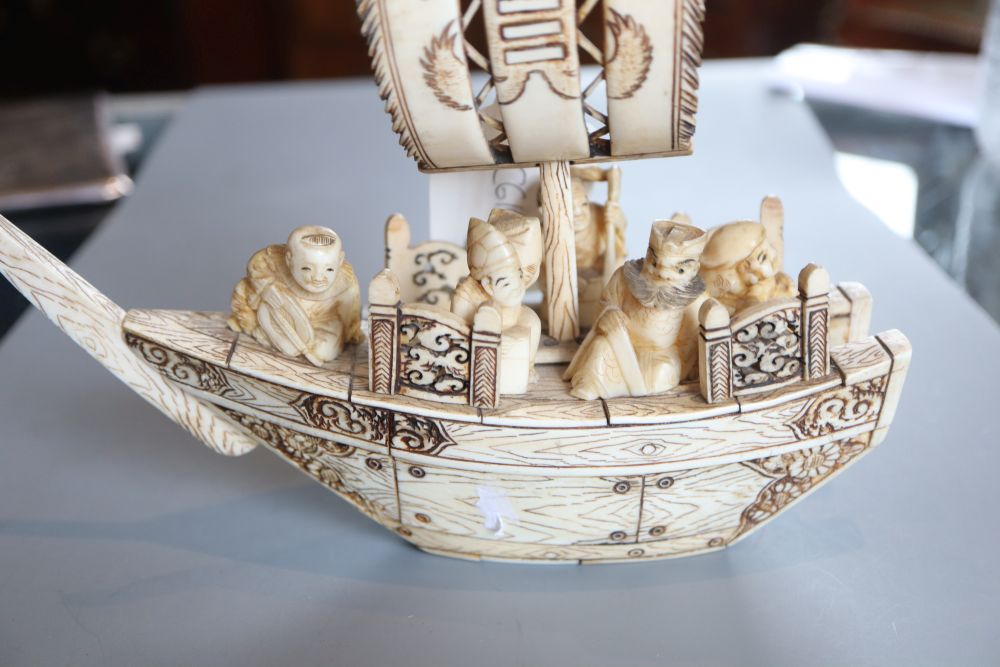 A Japanese marine ivory carving of the treasure ship and passengers, early 20th century, L. 19.5cm